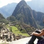 A woman hallucinating tourist looking at Machu Picchu, Machu Picchu, Peru
