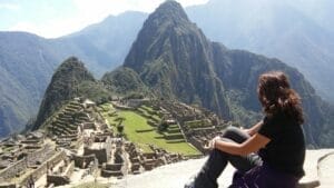 A woman hallucinating tourist looking at Machu Picchu, Machu Picchu, Peru