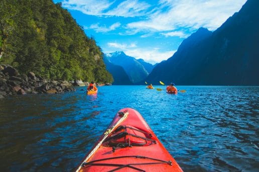 Canoe kayak adventure milford sound water travel fjord fiord lake exploration nature outdoors