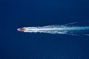 Fast boat at the sea in Bali, Indonesia. Aerial view of luxury floating boat