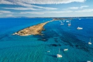 Aerial view over the clear beach and turquoise water of Formentera, Ibiza