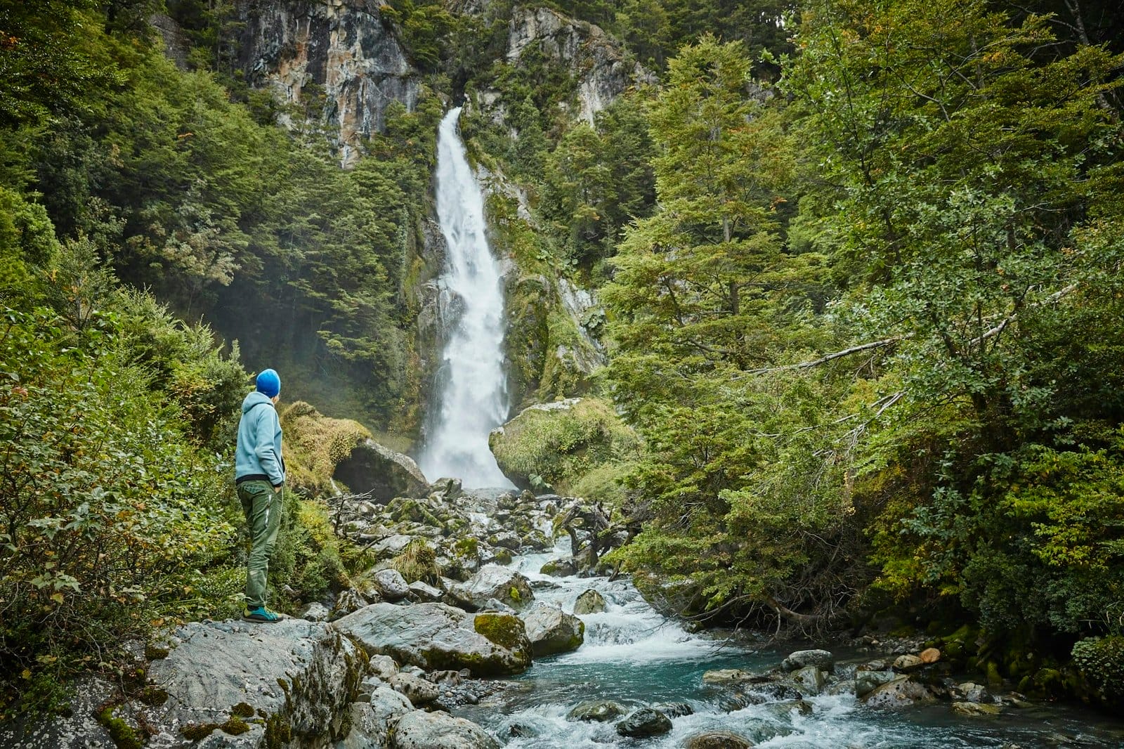 Chile, Laguna San Rafael National Park, woman admiring Las Cascadas waterfall