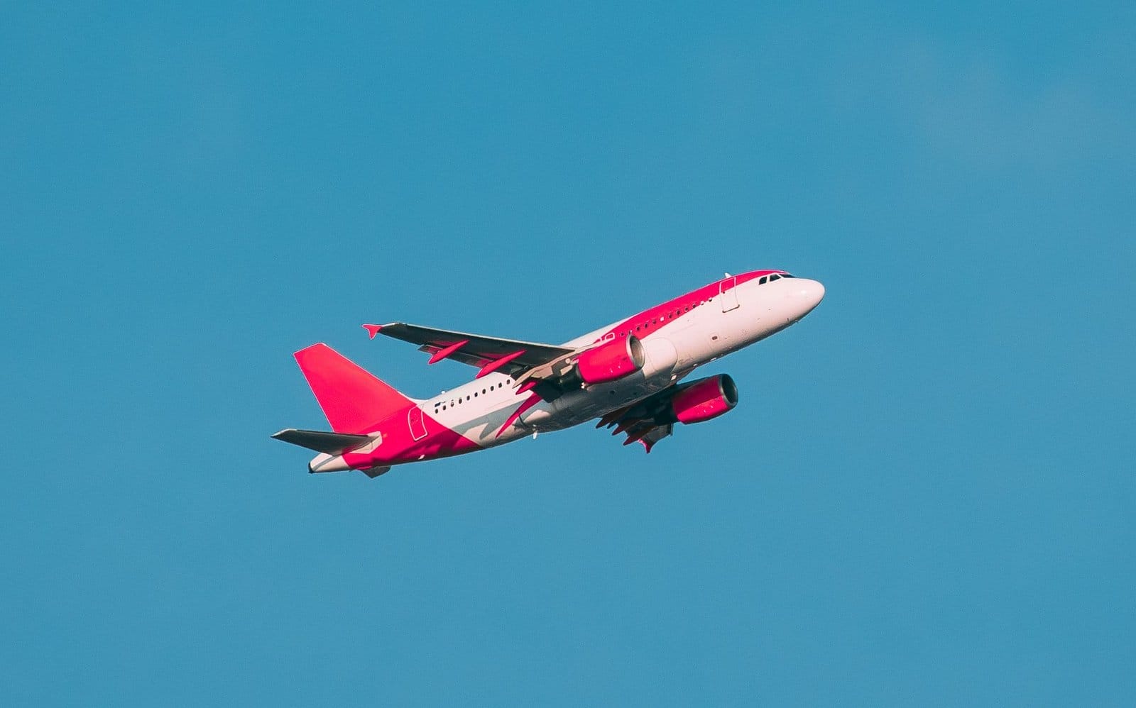 Airplane Of Airlines Flying In cloudy Sky
