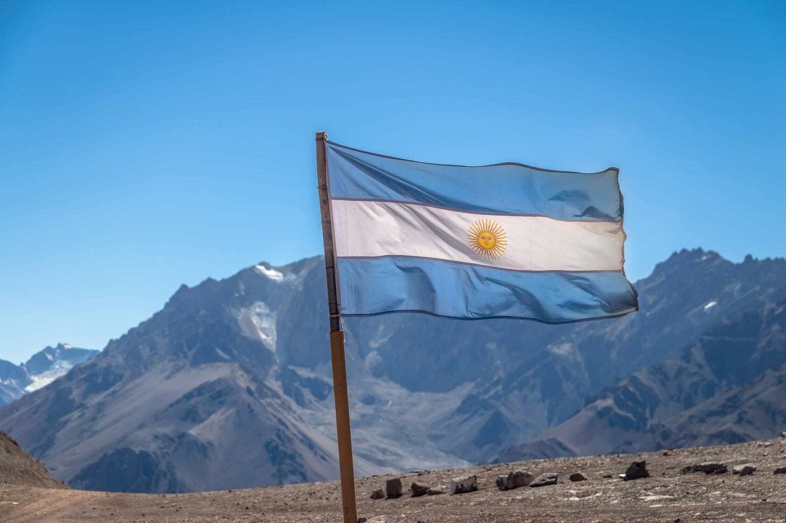Argentina flag with Cerro Tolosa Mountain in Cordillera de Los Andes - Mendoza Province, Argentina