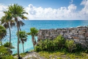 Maya wall ruins, Caribbean sea and Palm Trees - Tulum, Mexico