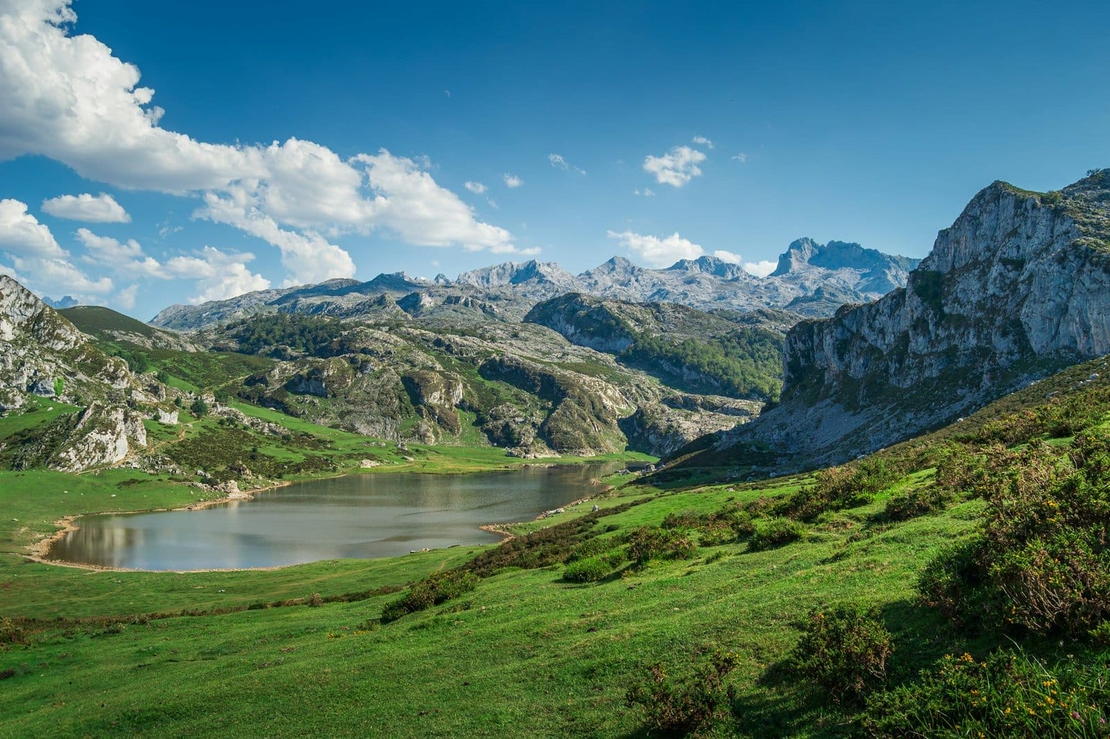 Scenic view of Covadonga Lakes in Asturias, Spain against a cloudy blue sky
