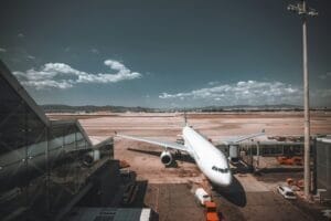 A white airplane during boarding