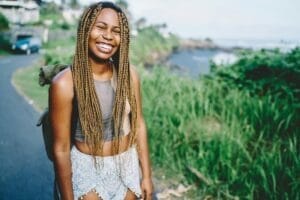 Joyful wanderer laughing and rejoicing during getaway trip