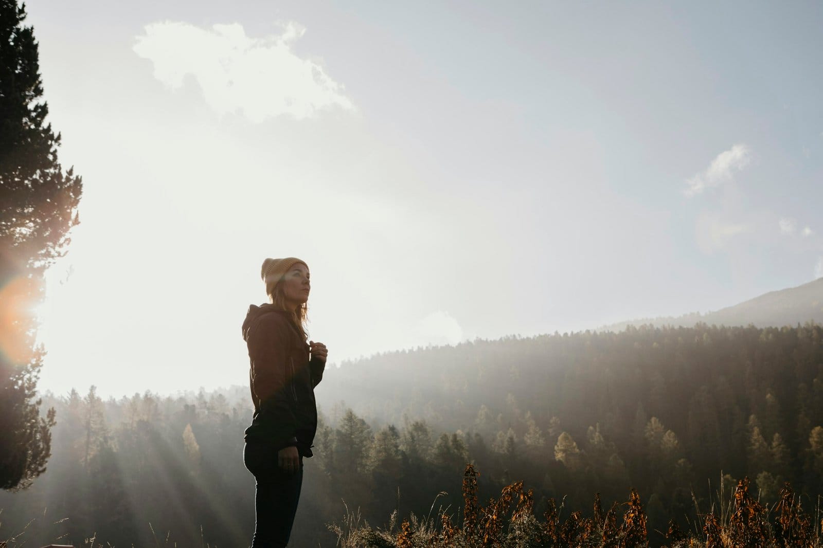 Switzerland, Engadin, woman on a hiking trip in mountain forest