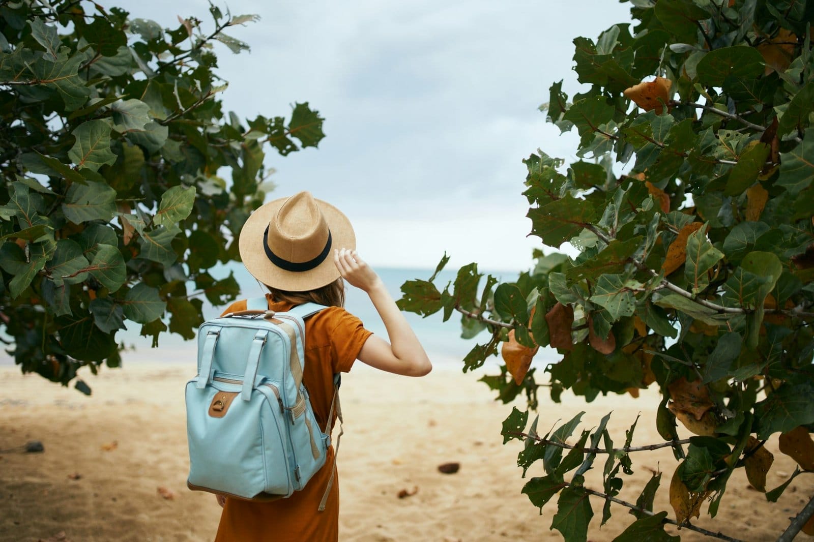 woman with backpack travel walk island fresh air