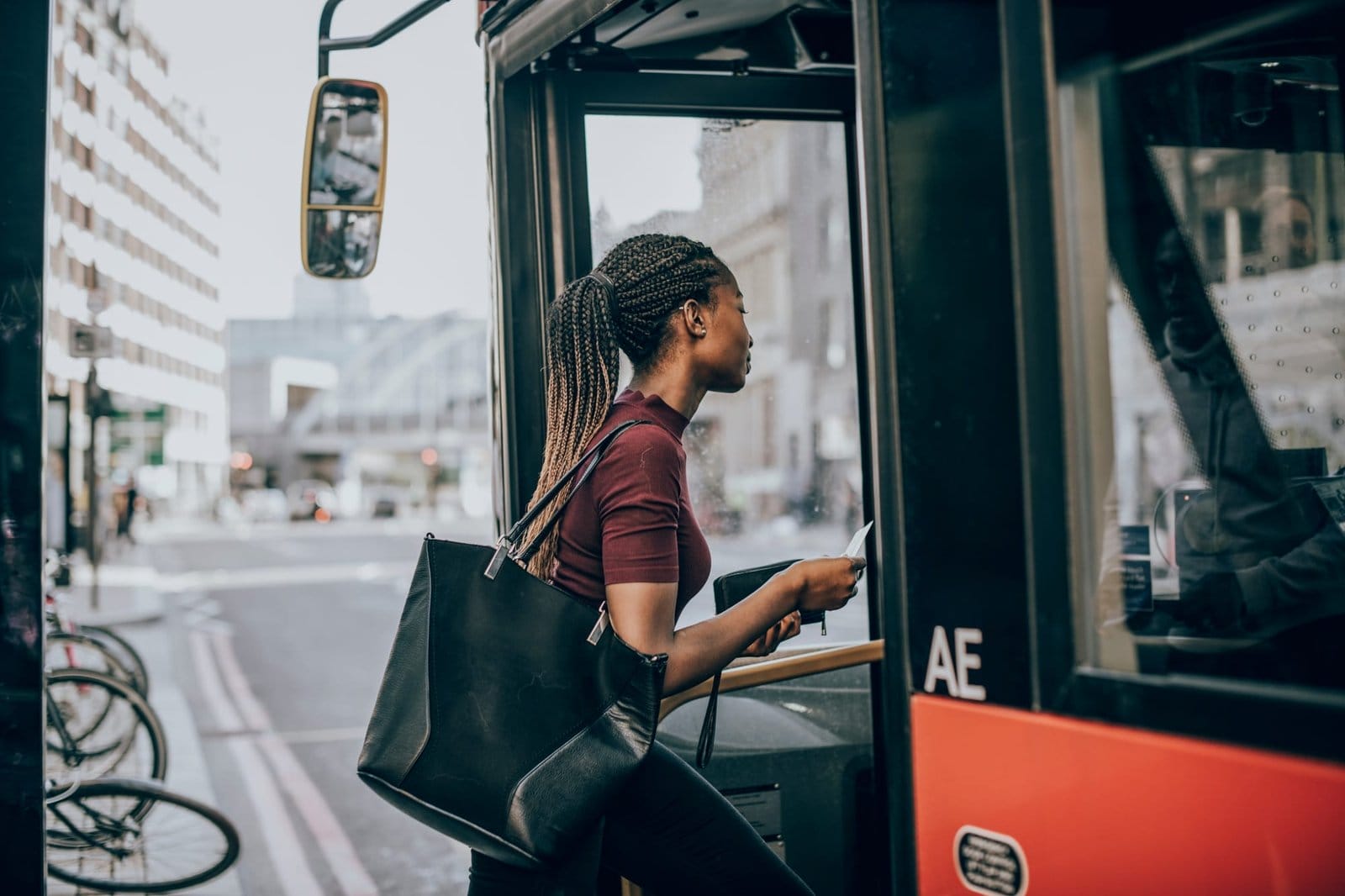 Woman getting on the bus