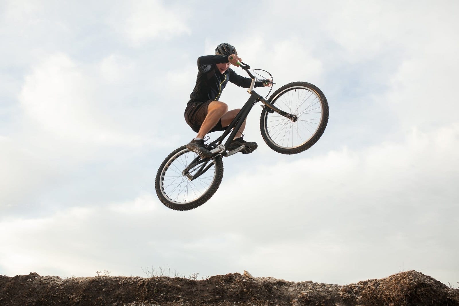 man jumping on a bike