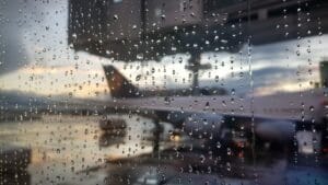 Rainy day at the airport, view through the window