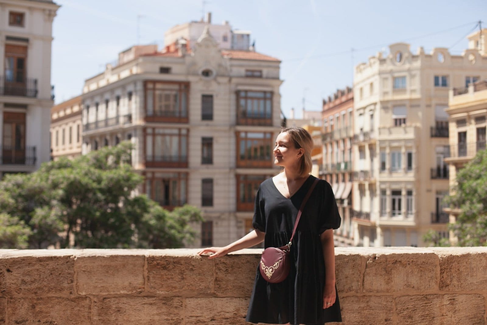 young beautiful female tourist in Spain visiting castle tower, tourism in Europe, European vacation