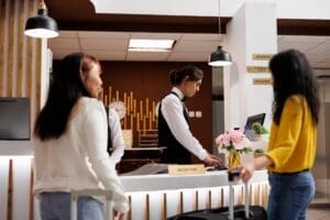 Hotel reception with two female guests