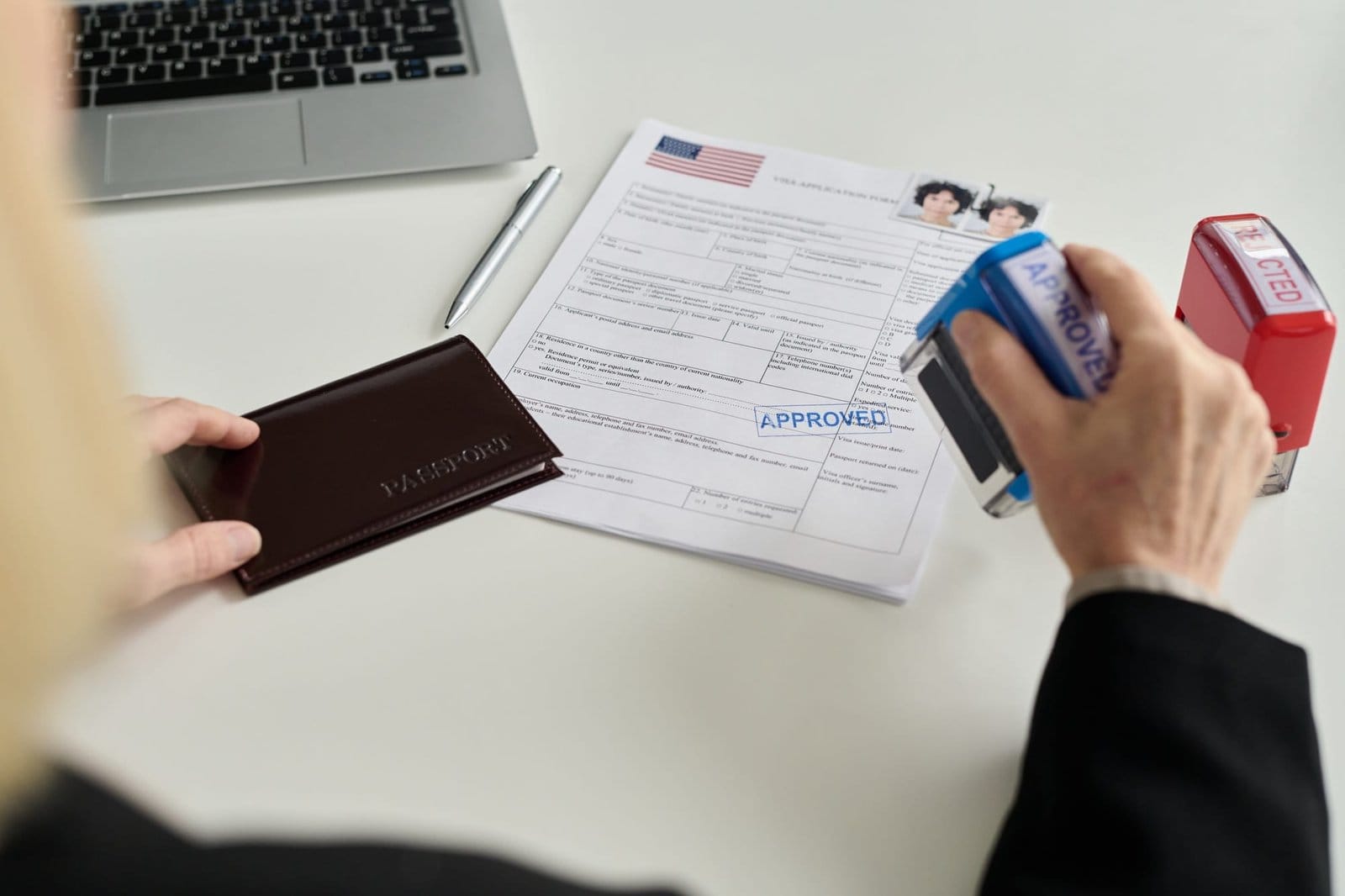 Immigration office worker approving visa