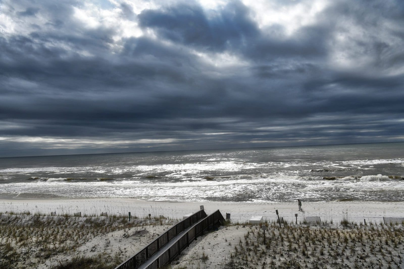 Jogger in the rain along the beach
