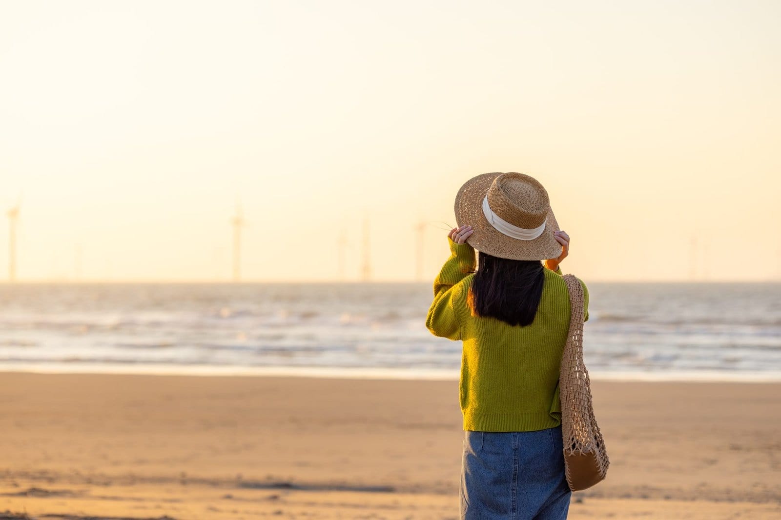 Travel woman enjoy the sunset view on beach