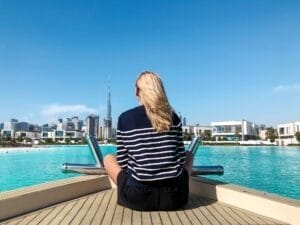Woman sitting on the boat with a View on Burj Khalifa from canal