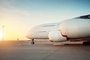 Huge airplane at the sunset