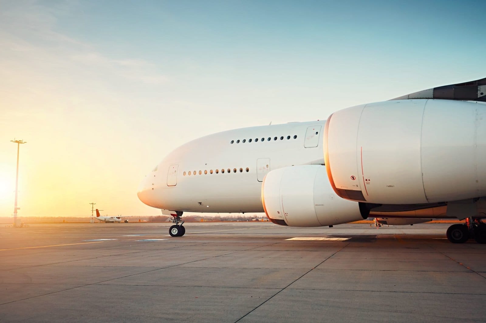 Huge airplane at the sunset