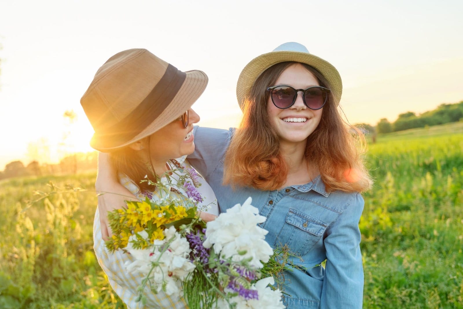 Mothers day, hugging happy smiling teenager daughter with mother