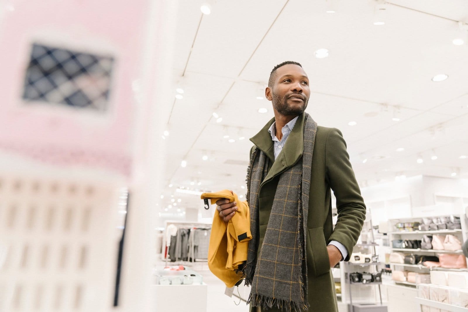 Stylish man shopping in a clothes store