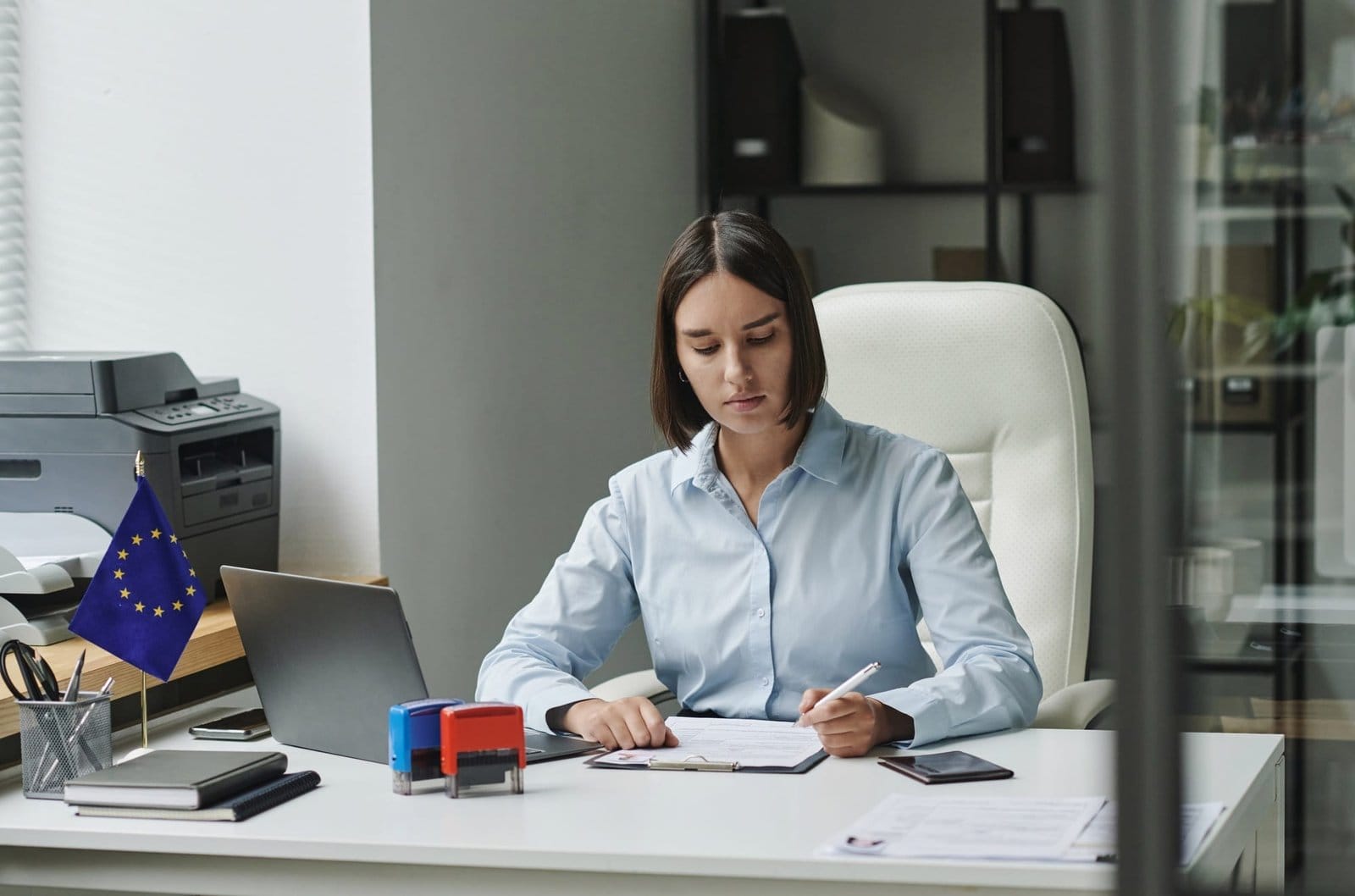 Visa service employee working with visa documents